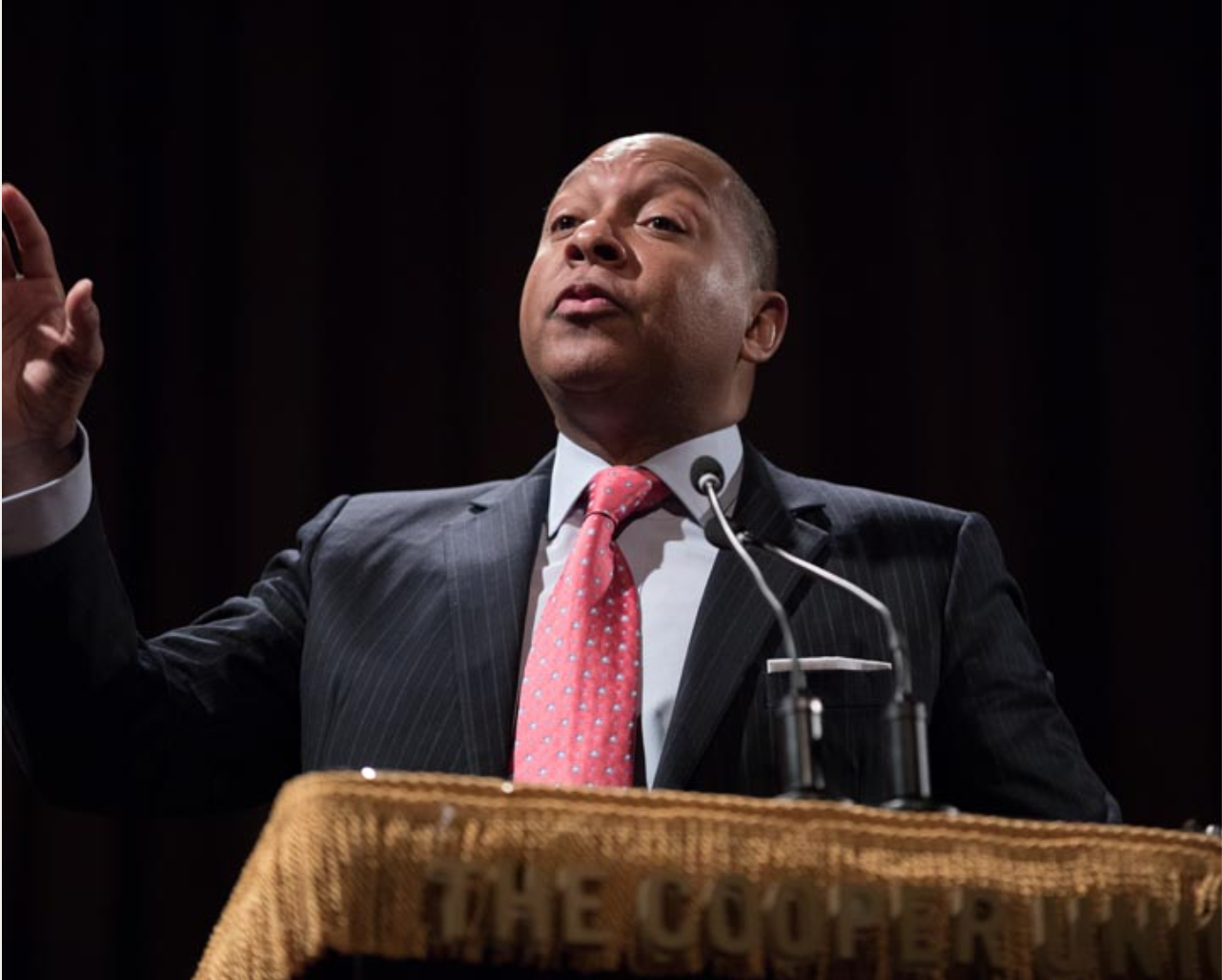 Corporate executive speaker presenting at podium with microphone at Cooper Union event produced by CitiView AV