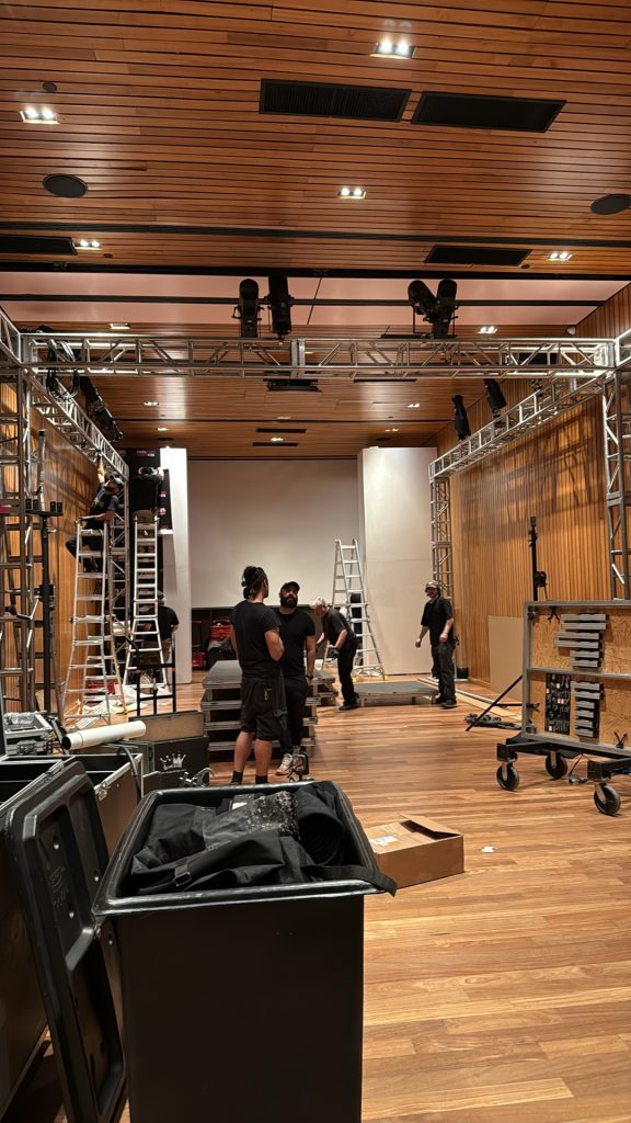 CitiView Audio Visual crew rigging truss and lighting during an event load-in